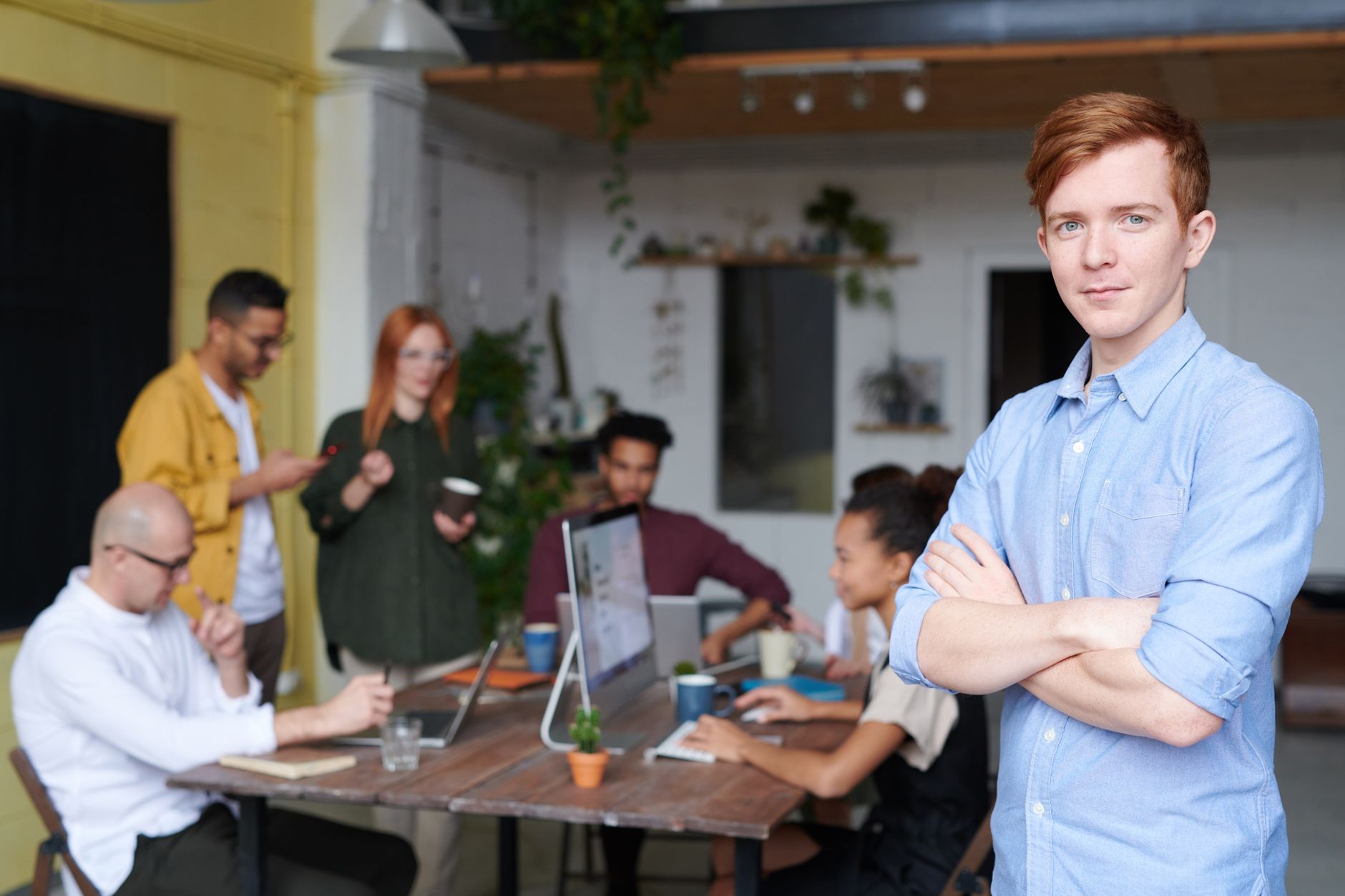 Small business team members reviewing a digital dashboard together in an office