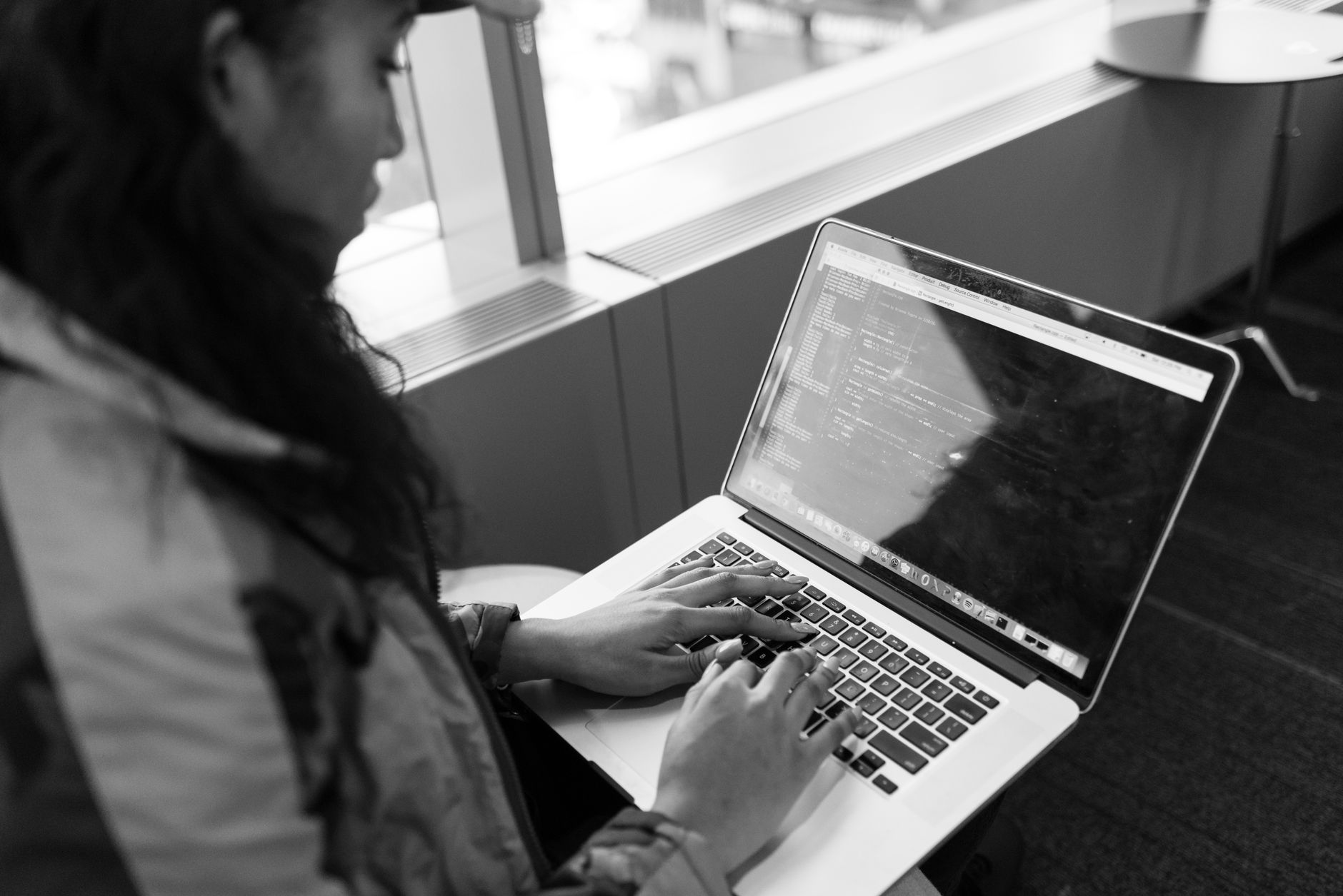 A developer working on a laptop, representing power users evaluating productivity tools