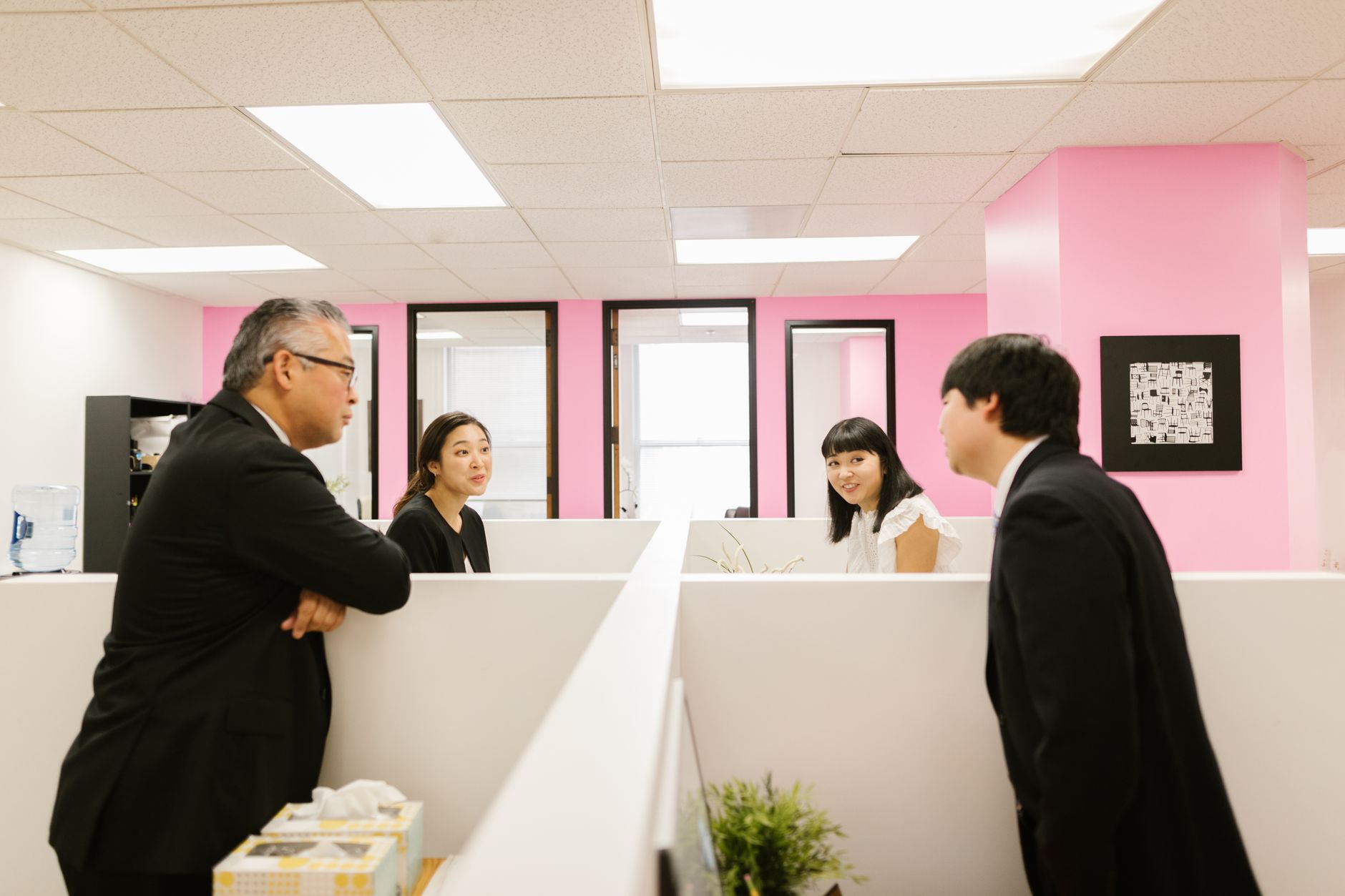 Sales team collaborating around a conference table in a modern office