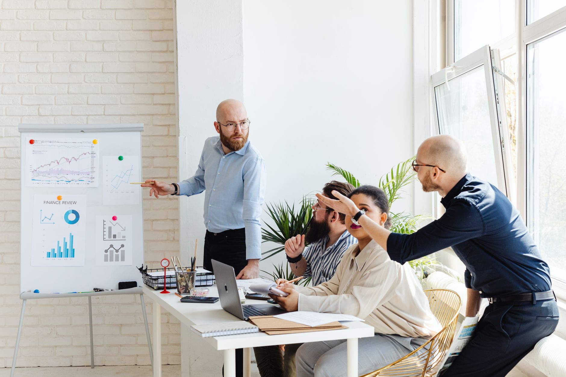 Team of executives in a conference room discussing software platform decisions