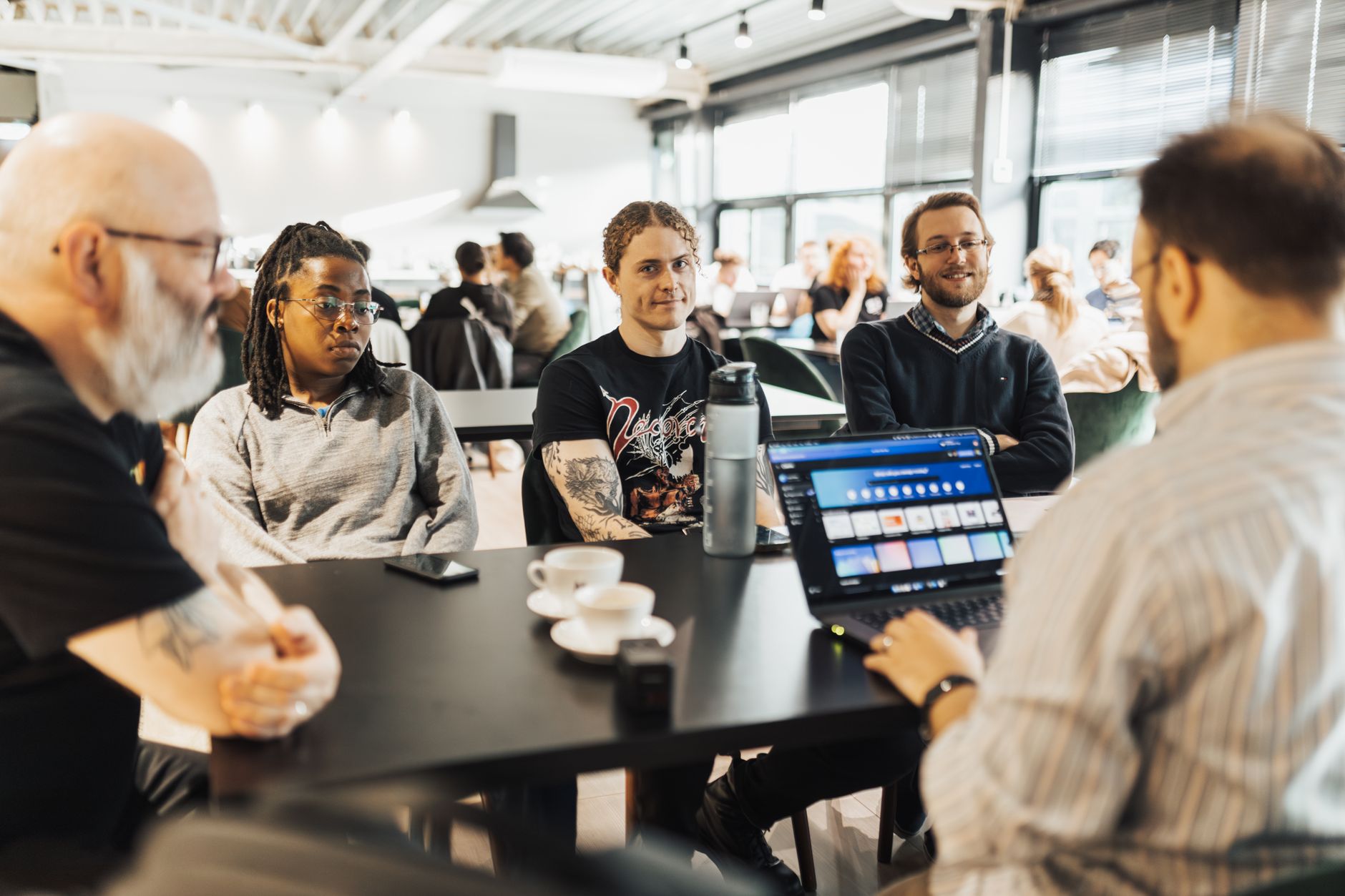 Engineering team discussing platform tool decisions in an office setting